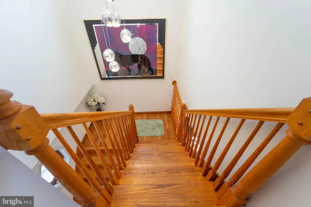 a bedroom with a bed and a ceiling fan