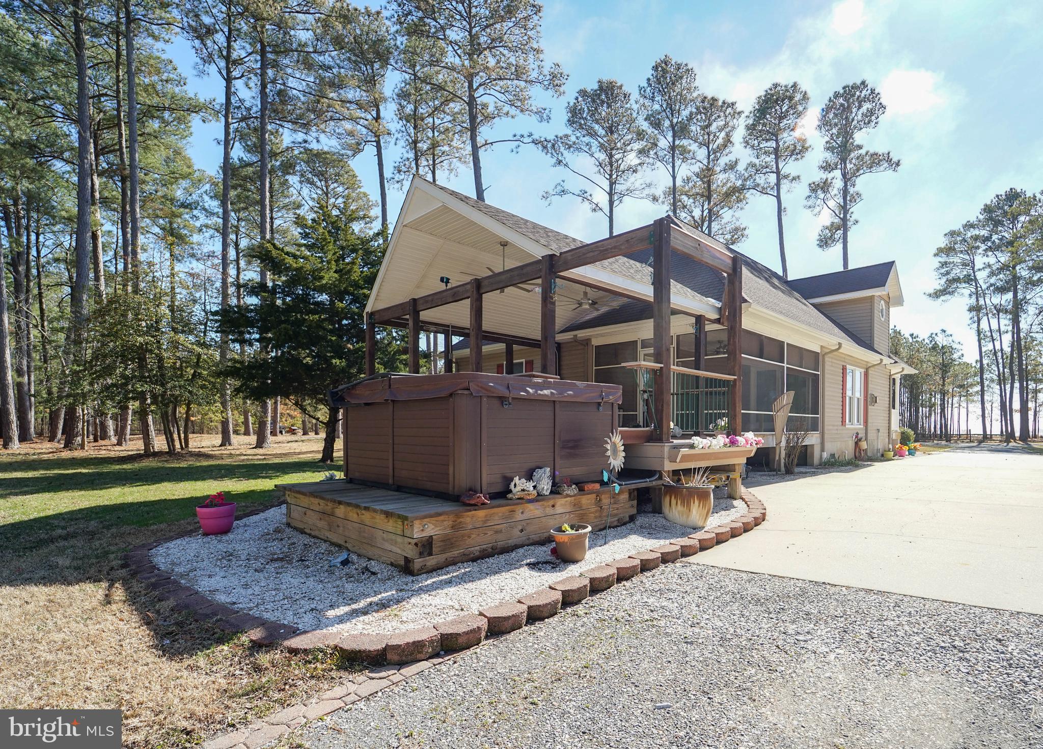 3313 Belfiore Road Church Creek, MD 21622 - Photo 6 of 70 a front view of a house with a yard and trees