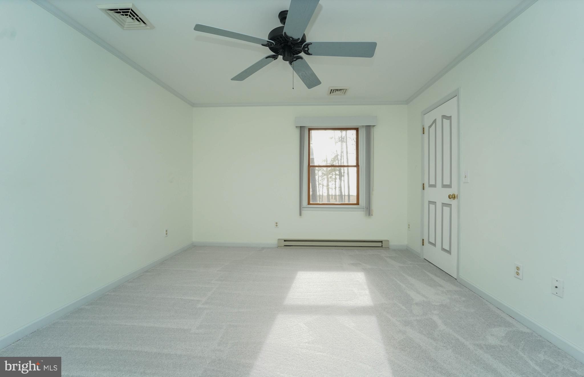 3313 Belfiore Road Church Creek, MD 21622 - Photo 63 of 70 an empty room with windows and fan