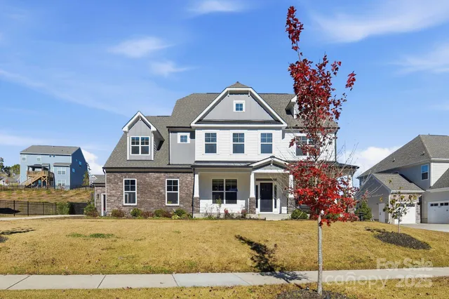 a balcony with table and chairs