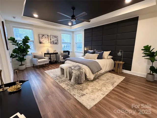 a bathroom with a granite countertop sink a toilet and a mirror