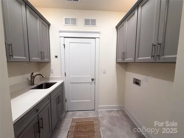 a view of a room with a window and a ceiling fan