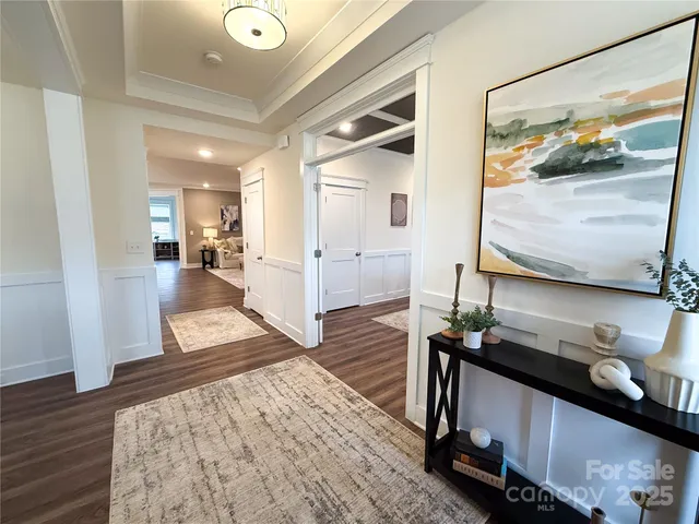 a kitchen with kitchen island a white counter space a sink appliances and cabinets