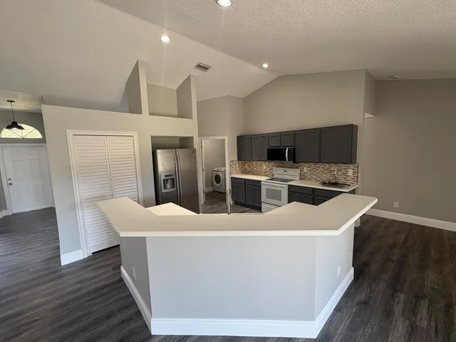 a room with furniture and wooden floor