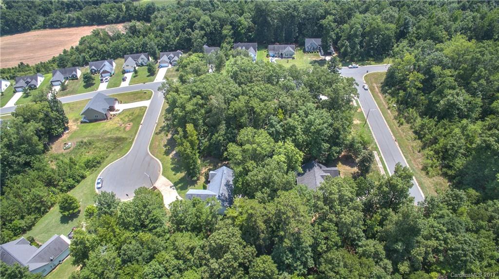 0 Sapphire Road, Unit 22 Albemarle, NC 28001 - Photo 7 of 9 an aerial view of residential house with outdoor space and trees all around