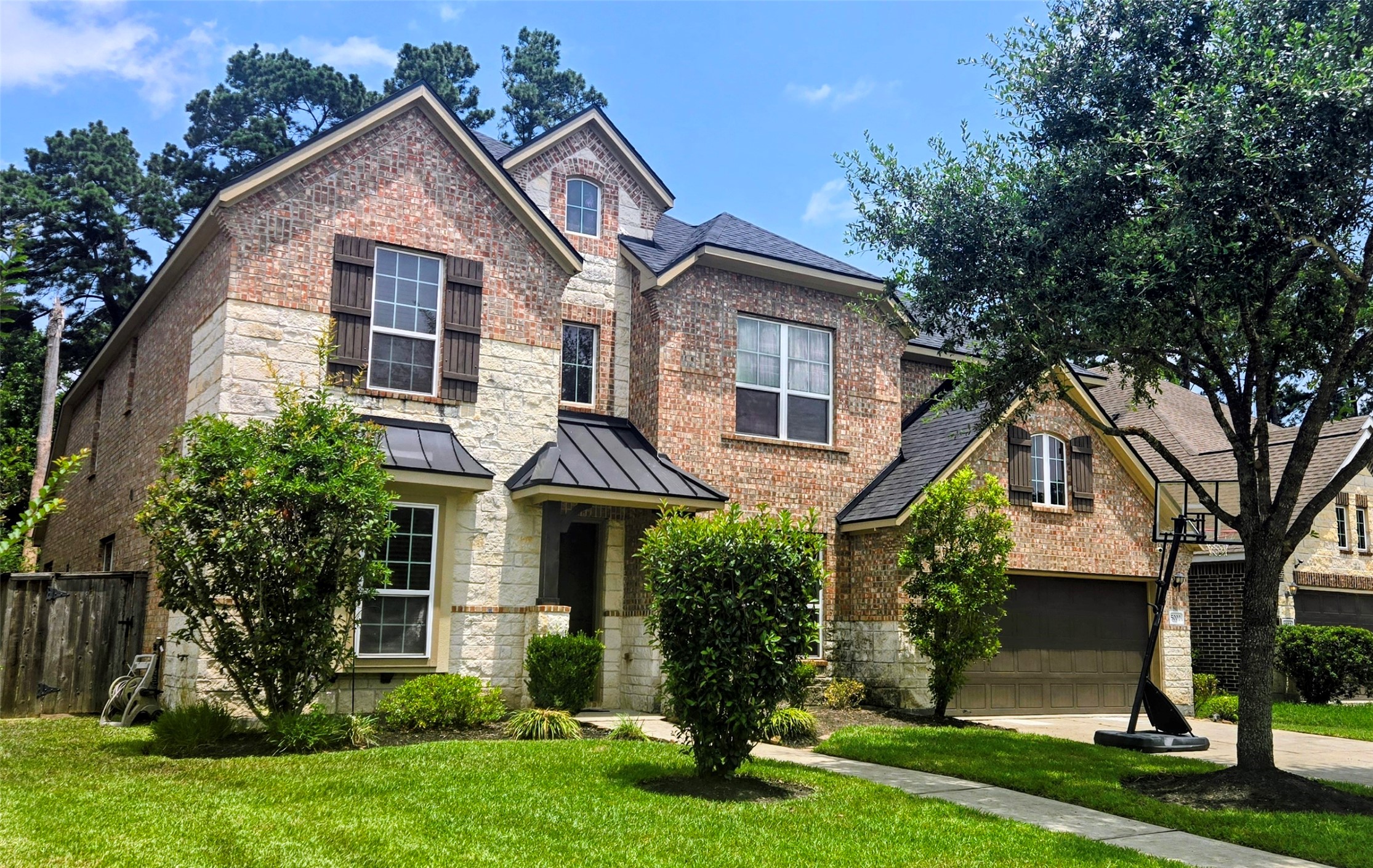 5002 Sawmill Terrace Lane Spring, TX 77389 - Photo 1 of 50 a front view of a house with a yard and trees