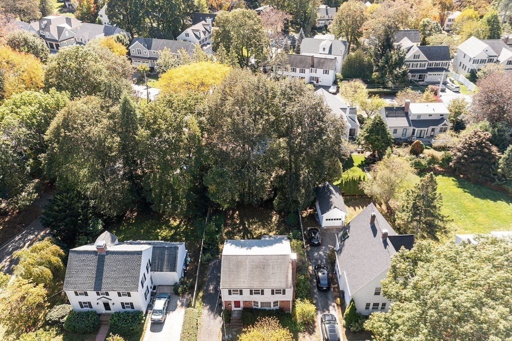 103 North Hancock Street Lexington, MA 02420 - Photo 12 of 18 an aerial view of a house with a yard and garden