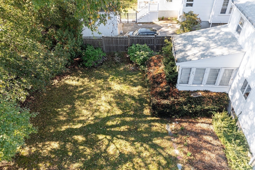 103 North Hancock Street Lexington, MA 02420 - Photo 6 of 18 a view of a house with a tree