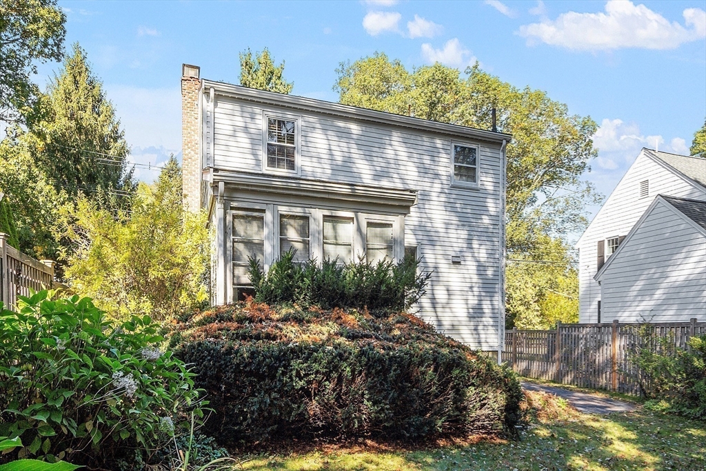103 North Hancock Street Lexington, MA 02420 - Photo 10 of 18 a front view of a house with a yard