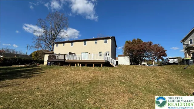 a view of a street with a building in the background