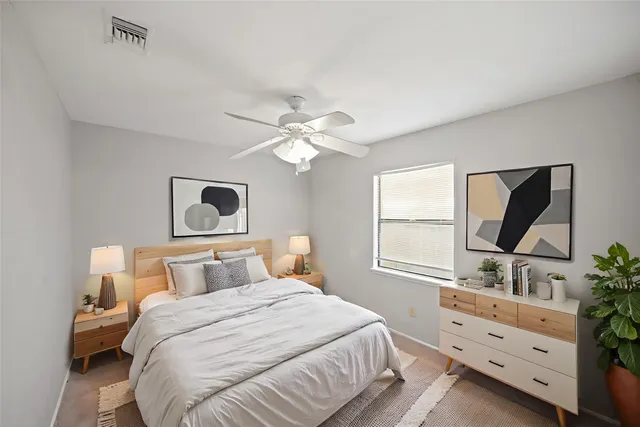 a bedroom with a bed and a dresser