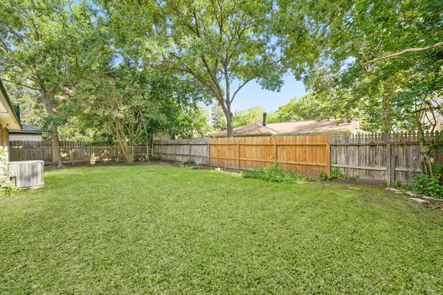 a view of backyard with green space