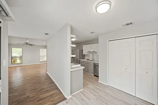 a view of a kitchen from the hallway