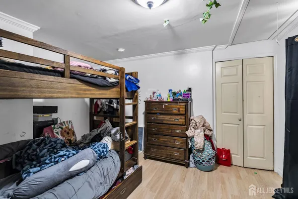 a bedroom with furniture and closet