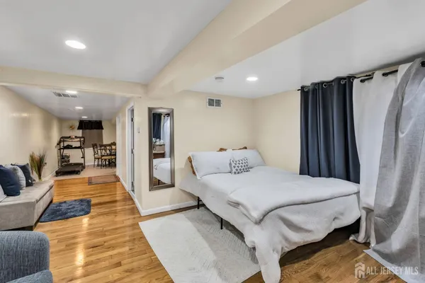 a bedroom with a bed and a couch
