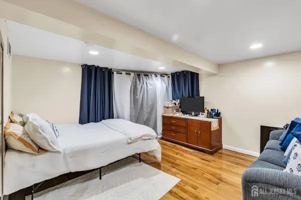 a bedroom with a bed and a couch