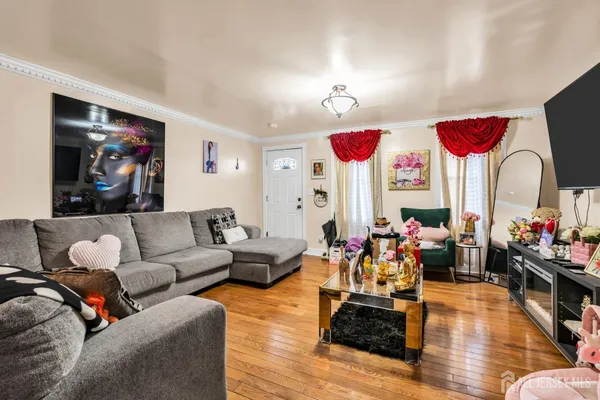 a living room with fireplace furniture and a flat screen tv