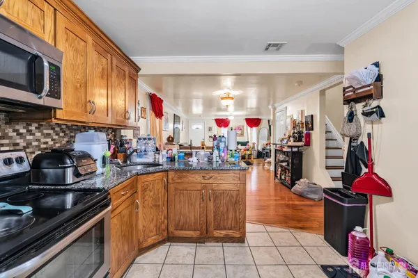 a kitchen with lots of counter top space and appliances