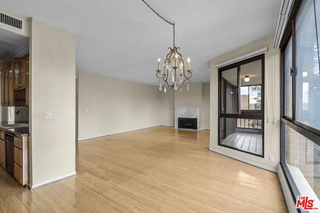 a view of an empty room with a chandelier