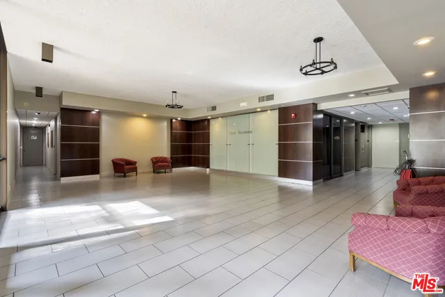 a view of a livingroom with furniture and a window
