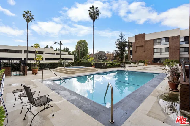 a view of a swimming pool with a lounge chairs