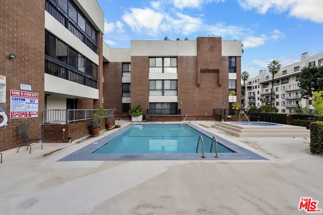 a multi story building with view of the street