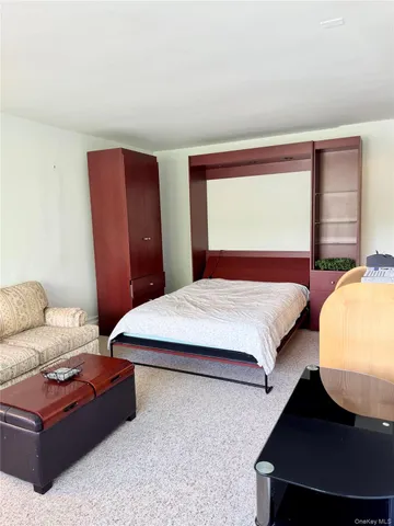 a bedroom with bed and window