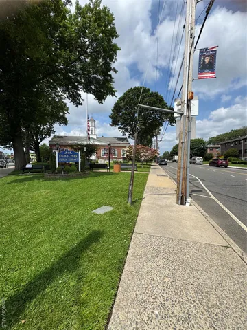 a view of a backyard of the apartment