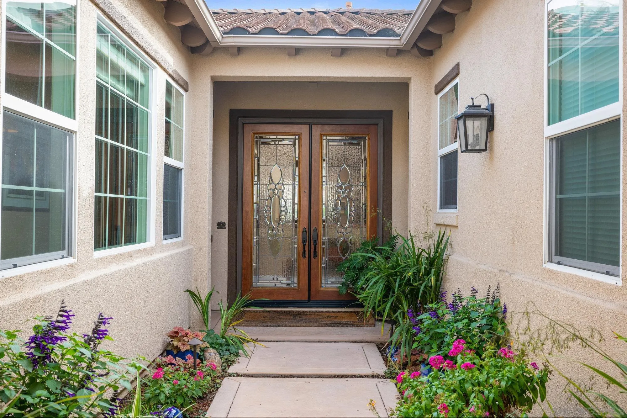 3267 Avenida Aragon Carlsbad, CA 92009 - Photo 2 of 11 a vase with flowers sitting on a floor