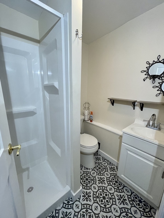 35 Iowa Street Worcester, MA 01602 - Photo 11 of 25 a bathroom with a sink toilet and shower