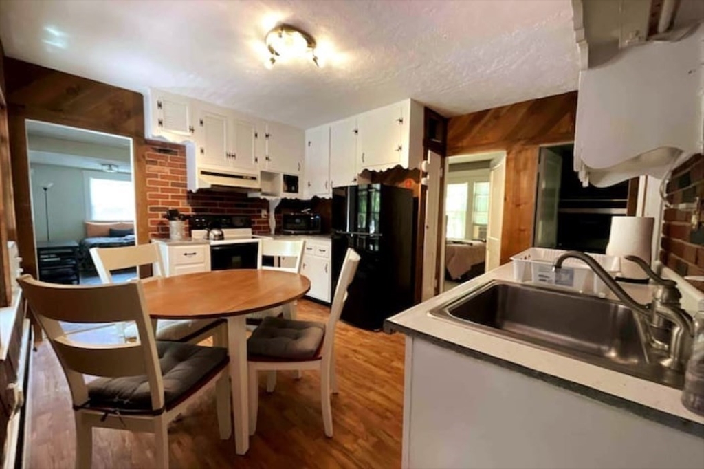 35 Iowa Street Worcester, MA 01602 - Photo 13 of 25 a kitchen that has a table and chairs in it