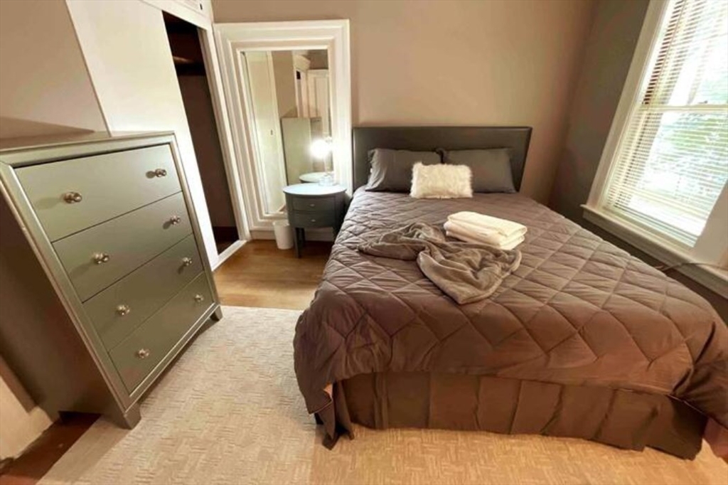 35 Iowa Street Worcester, MA 01602 - Photo 15 of 25 a bedroom with a bed and a mirror