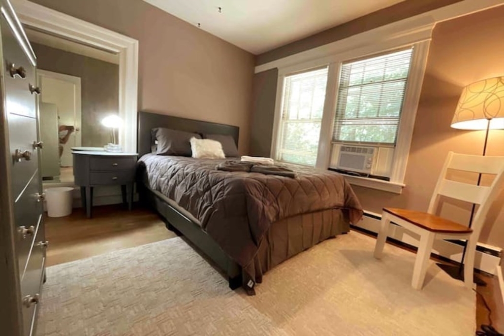 35 Iowa Street Worcester, MA 01602 - Photo 17 of 25 a bedroom with a bed and a window