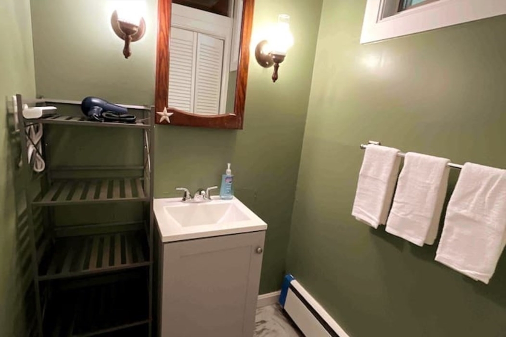 35 Iowa Street Worcester, MA 01602 - Photo 18 of 25 a bathroom with a sink toilet and mirror