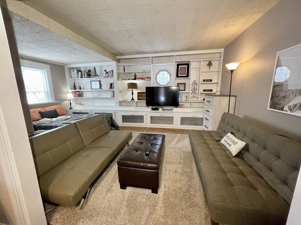 35 Iowa Street Worcester, MA 01602 - Photo 7 of 25 a living room with furniture and a wooden floor