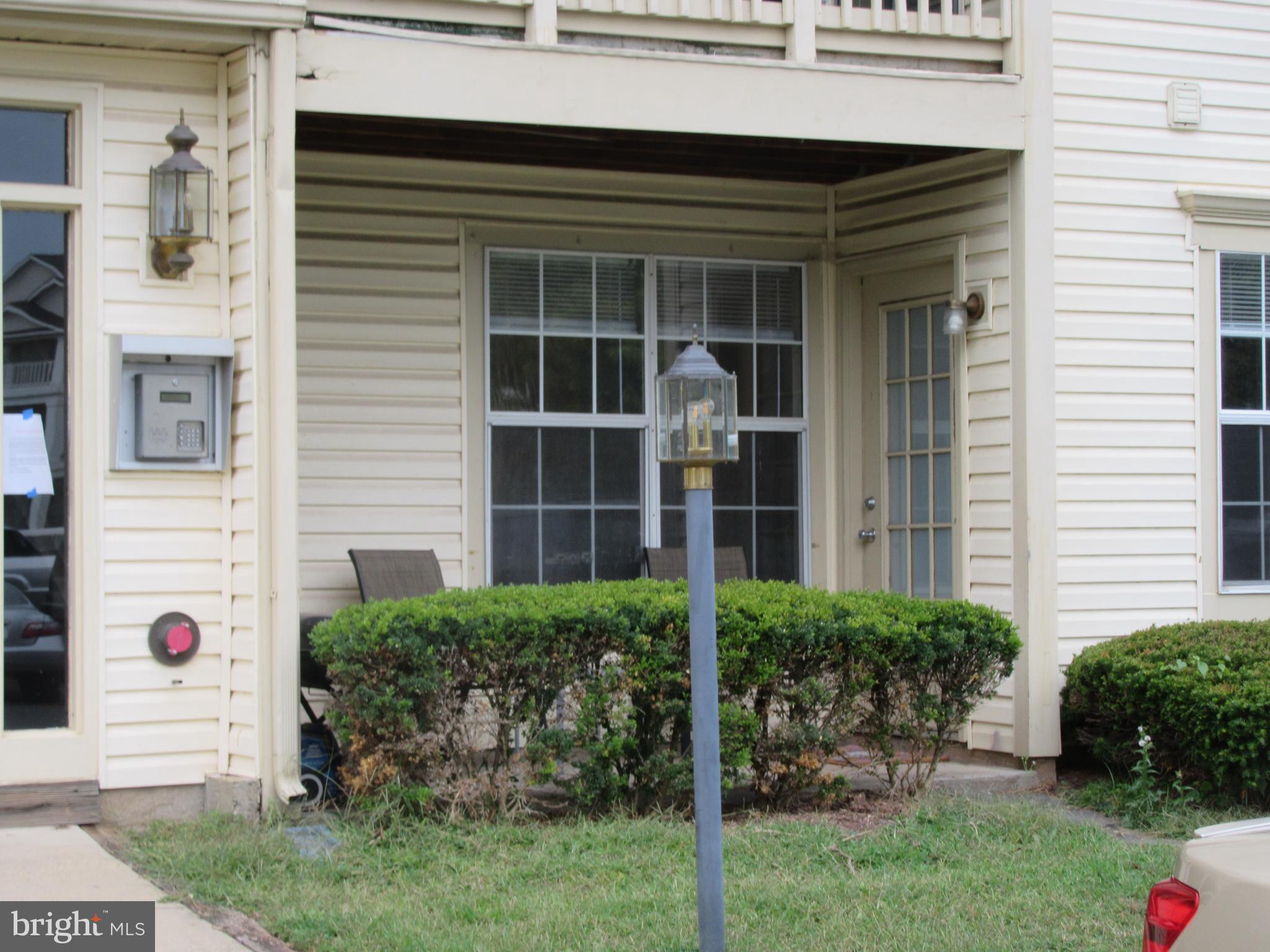 11006 Koman Circle, Unit 104 Manassas, VA 20109 - Photo 1 of 39 Outside porch front entrance door in unit 104.