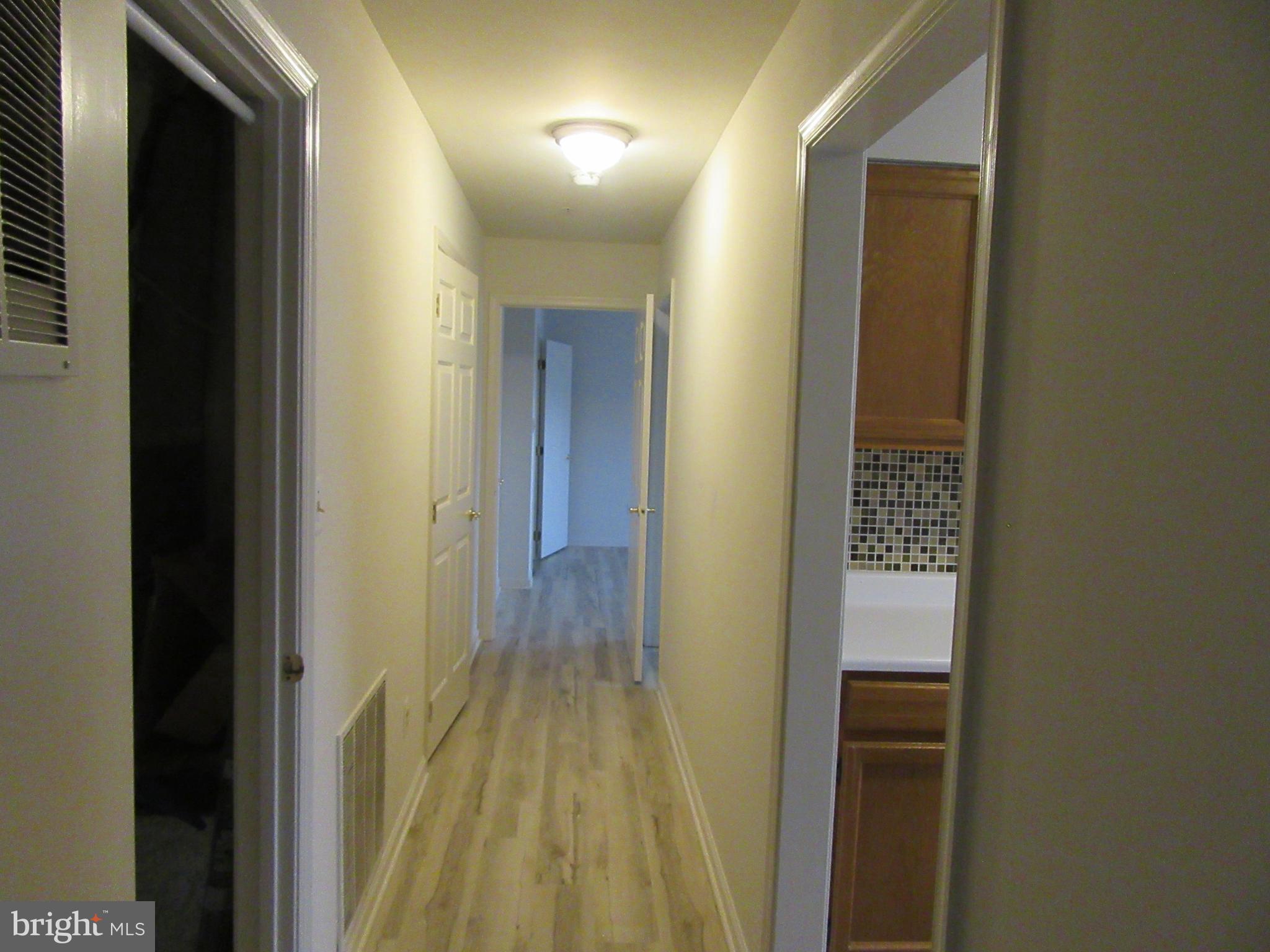 11006 Koman Circle, Unit 104 Manassas, VA 20109 - Photo 18 of 39 Hallway from LR