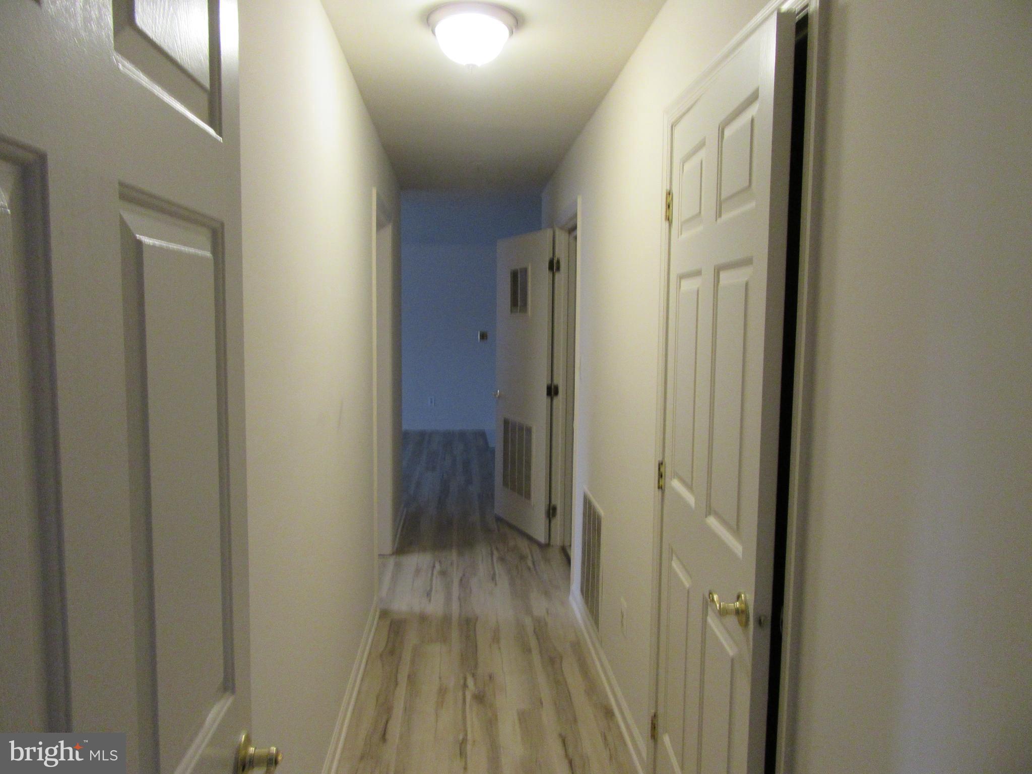 11006 Koman Circle, Unit 104 Manassas, VA 20109 - Photo 19 of 39 Hallway from BR