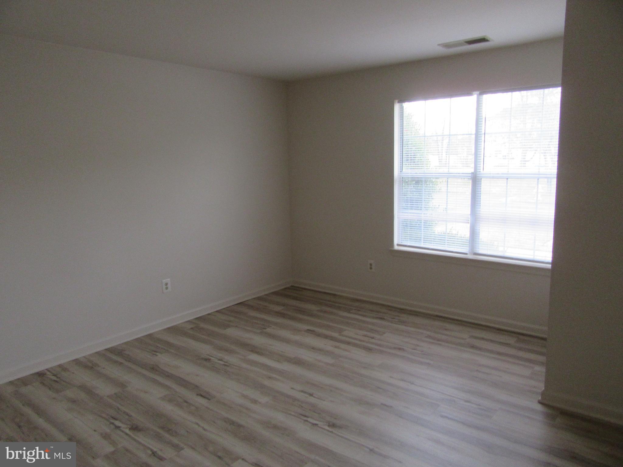 11006 Koman Circle, Unit 104 Manassas, VA 20109 - Photo 21 of 39 Primary Bedroom with new flooring