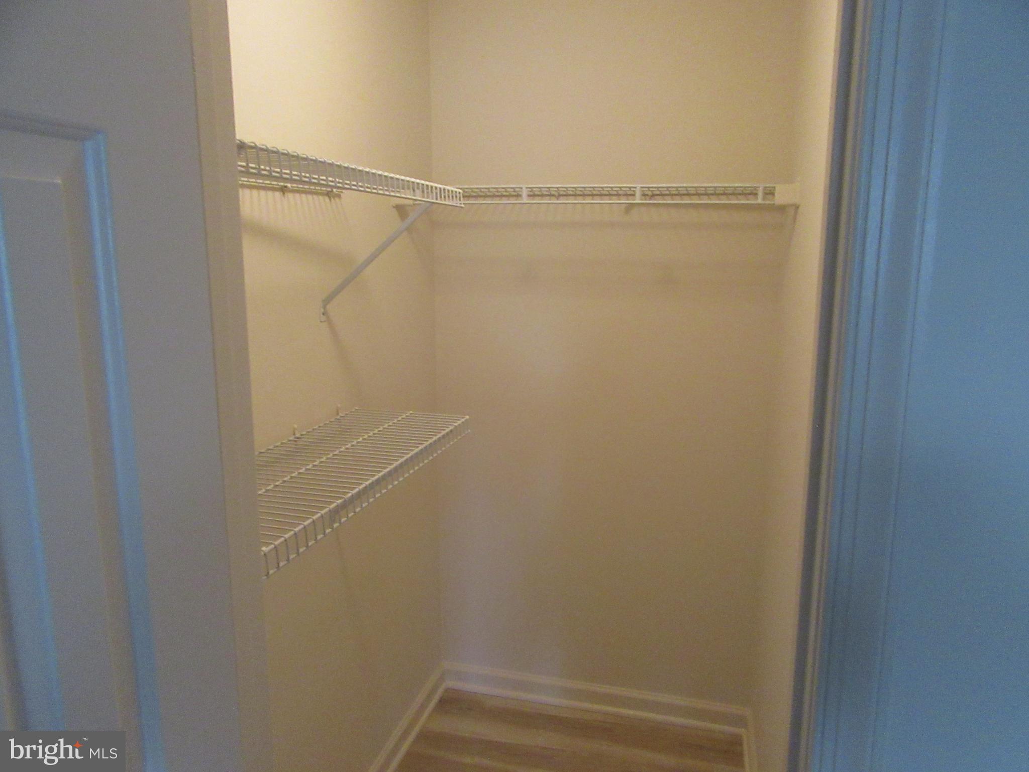 11006 Koman Circle, Unit 104 Manassas, VA 20109 - Photo 23 of 39 Walk in closet in Primary Bedroom