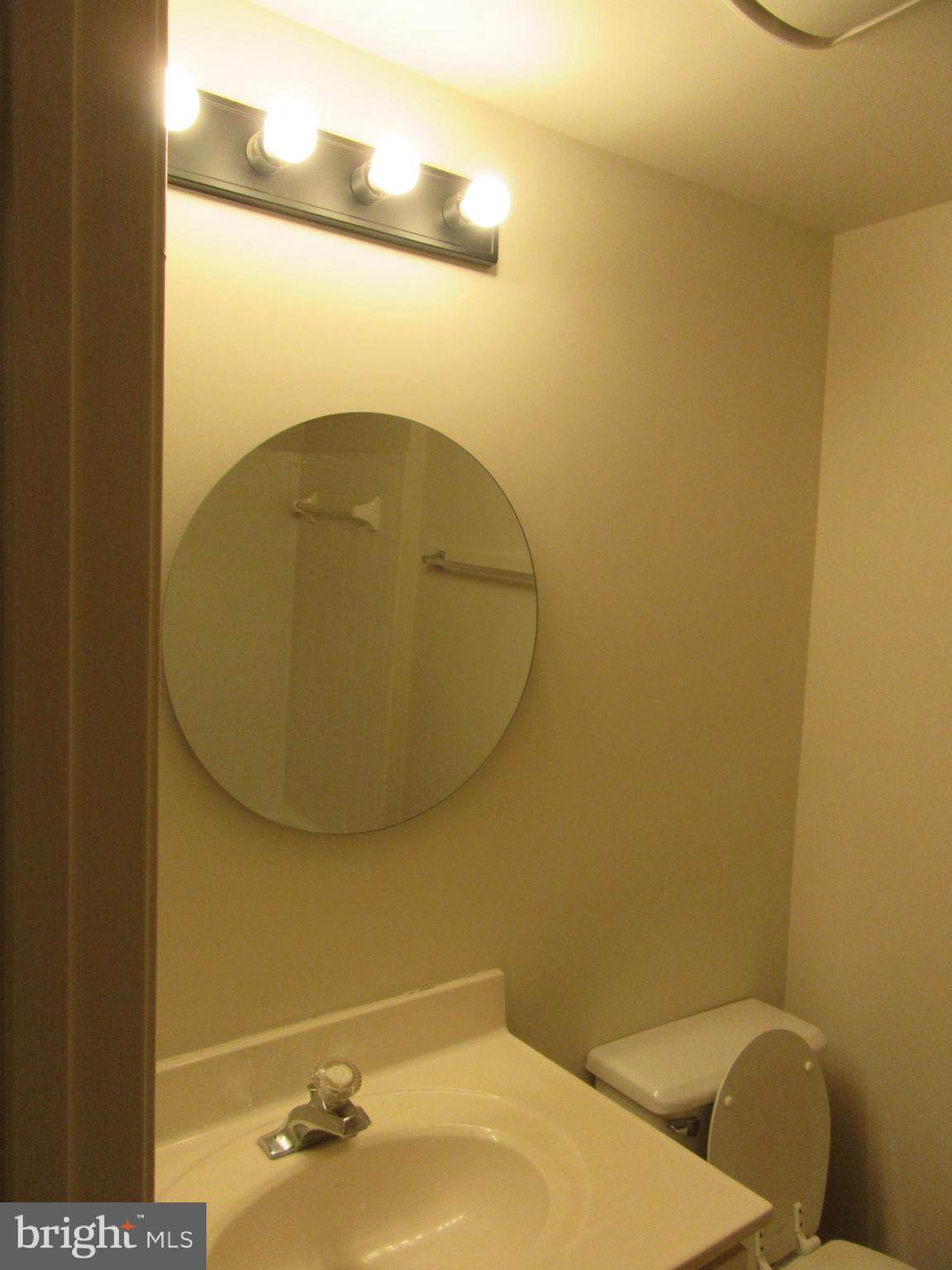 11006 Koman Circle, Unit 104 Manassas, VA 20109 - Photo 27 of 39 New light and mirror in guest bath