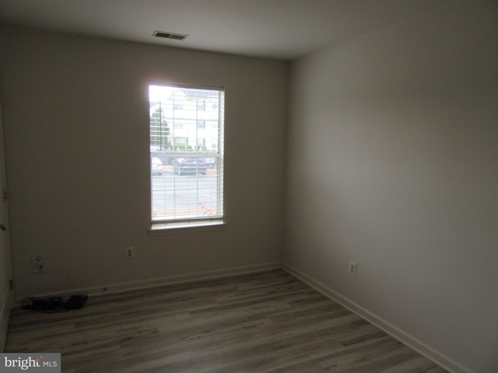 11006 Koman Circle, Unit 104 Manassas, VA 20109 - Photo 28 of 39 Bedroom 2 with new flooring