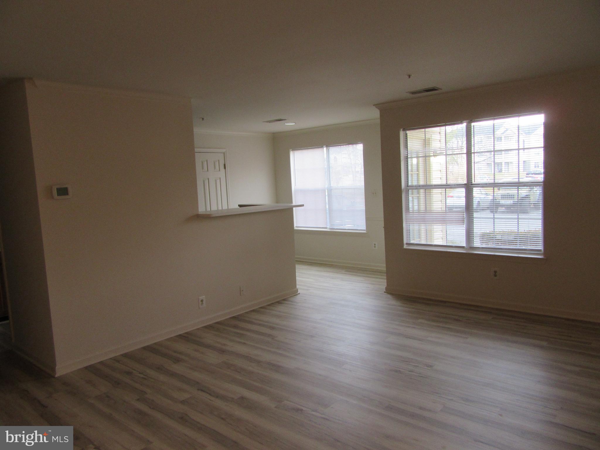 11006 Koman Circle, Unit 104 Manassas, VA 20109 - Photo 6 of 39 Living room and eat i kitchen with new LVP Floor.