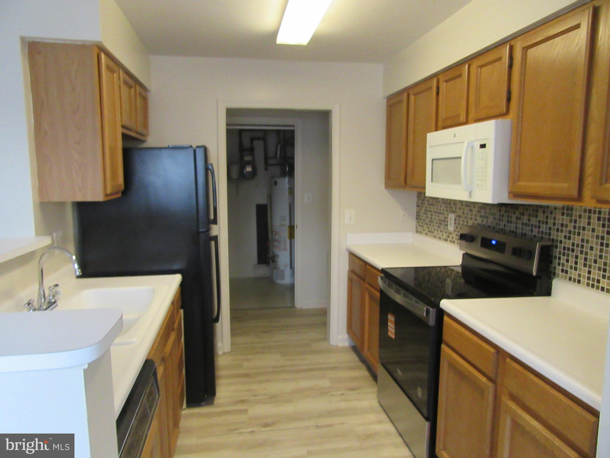11006 Koman Circle, Unit 104 Manassas, VA 20109 - Photo 9 of 39 Kitchen new stove and DW, newer Microwave and Ref