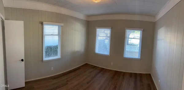 a view of an entryway with wooden floor
