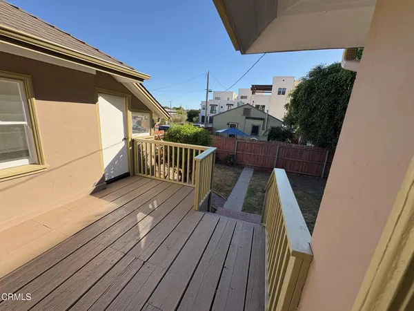 a view of balcony with wooden floor and stairs