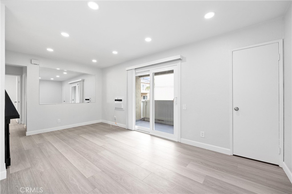 114 10th Street, Unit C Huntington Beach, CA 92648 - Photo 14 of 21 wooden floor in an empty room with wooden floor