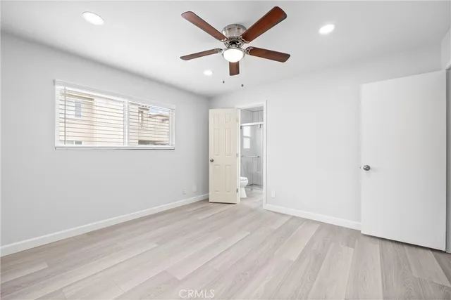 a bathroom with a granite countertop sink a shower and a mirror