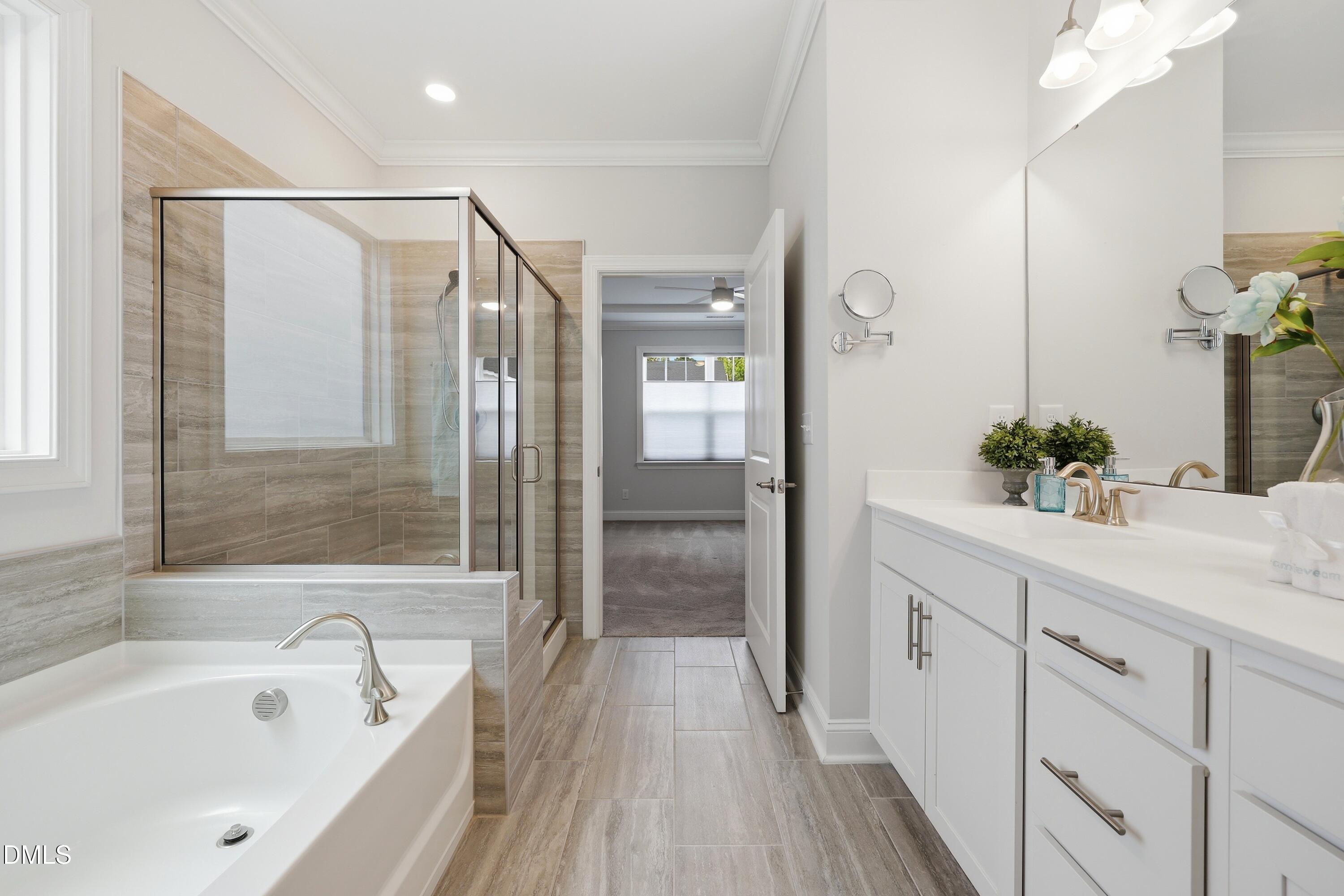 289 English Violet Lane Raleigh, NC 27610 - Photo 22 of 40 a bathroom with a bathtub and a sink