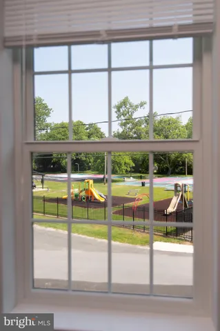 a view of a swimming pool with a balcony